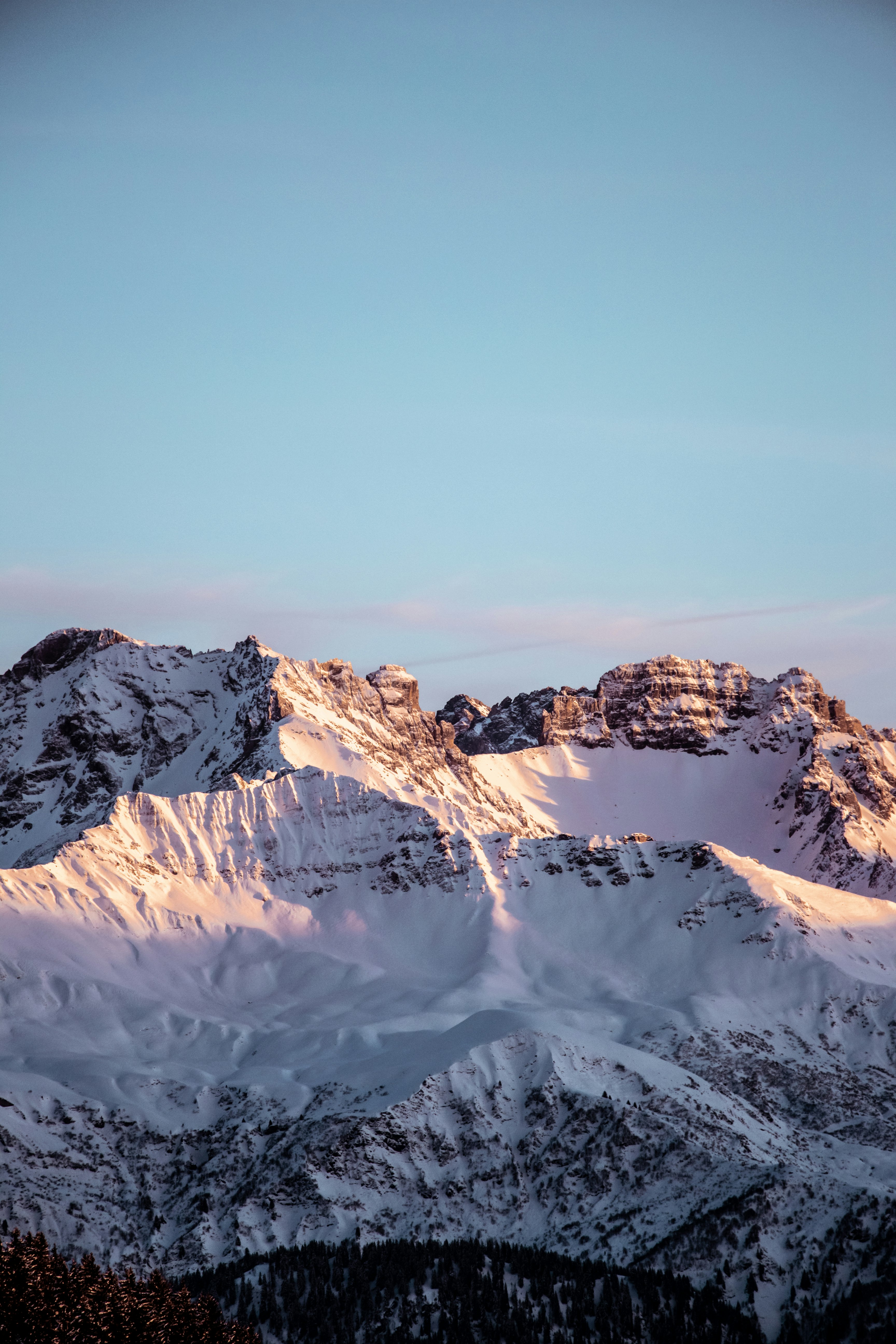 snow covered mountain under blue sky during daytime